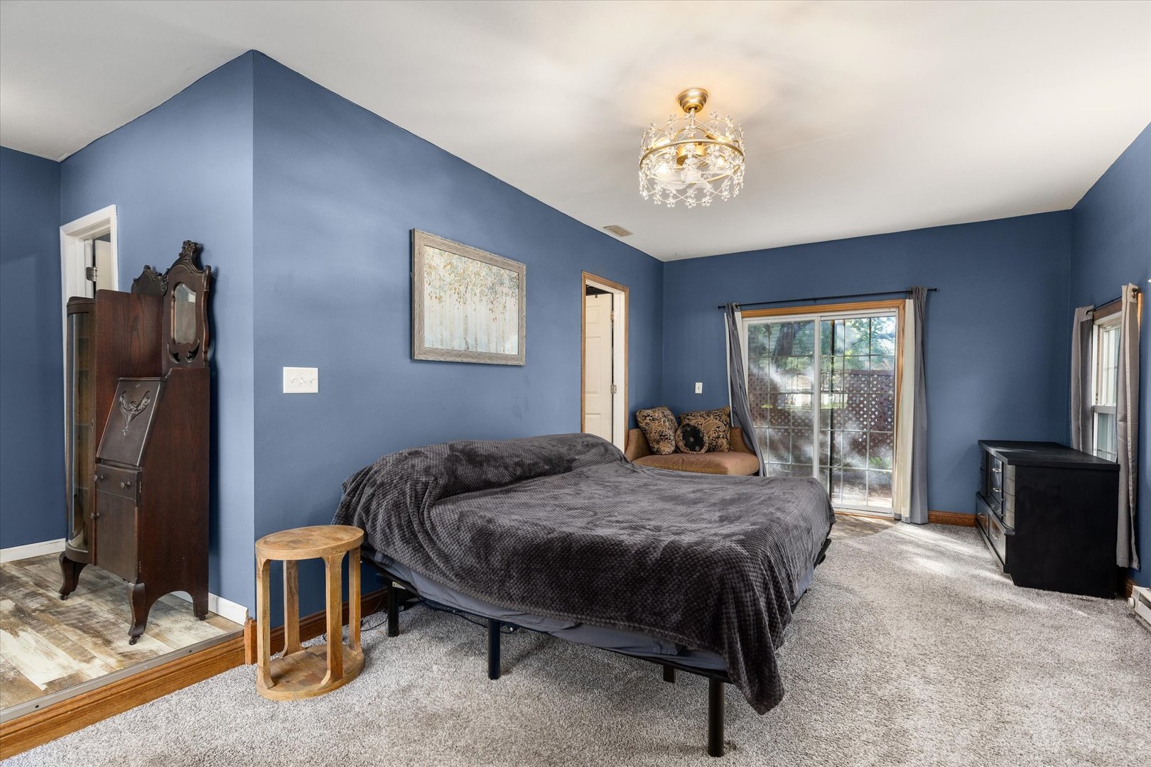 3440 Cardinal Lane Morris, IL 60450 - Photo 17 of 34 a bedroom with a bed and a chandelier