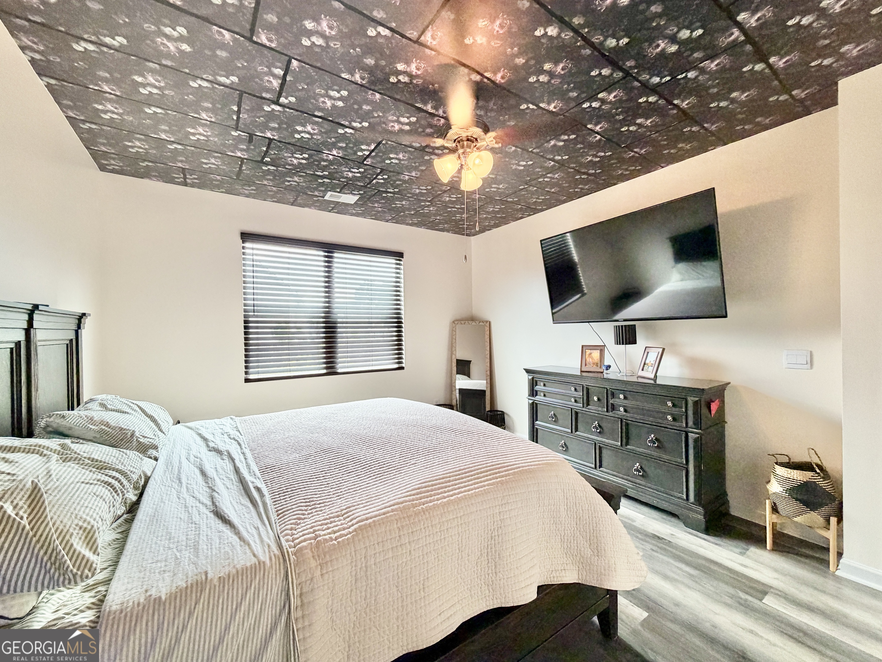 219 Barnyard Way Perry, GA 31069 - Photo 20 of 44 a bedroom with a bed and a flat screen tv