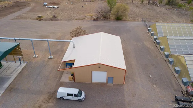 an aerial view of a house with a swimming pool