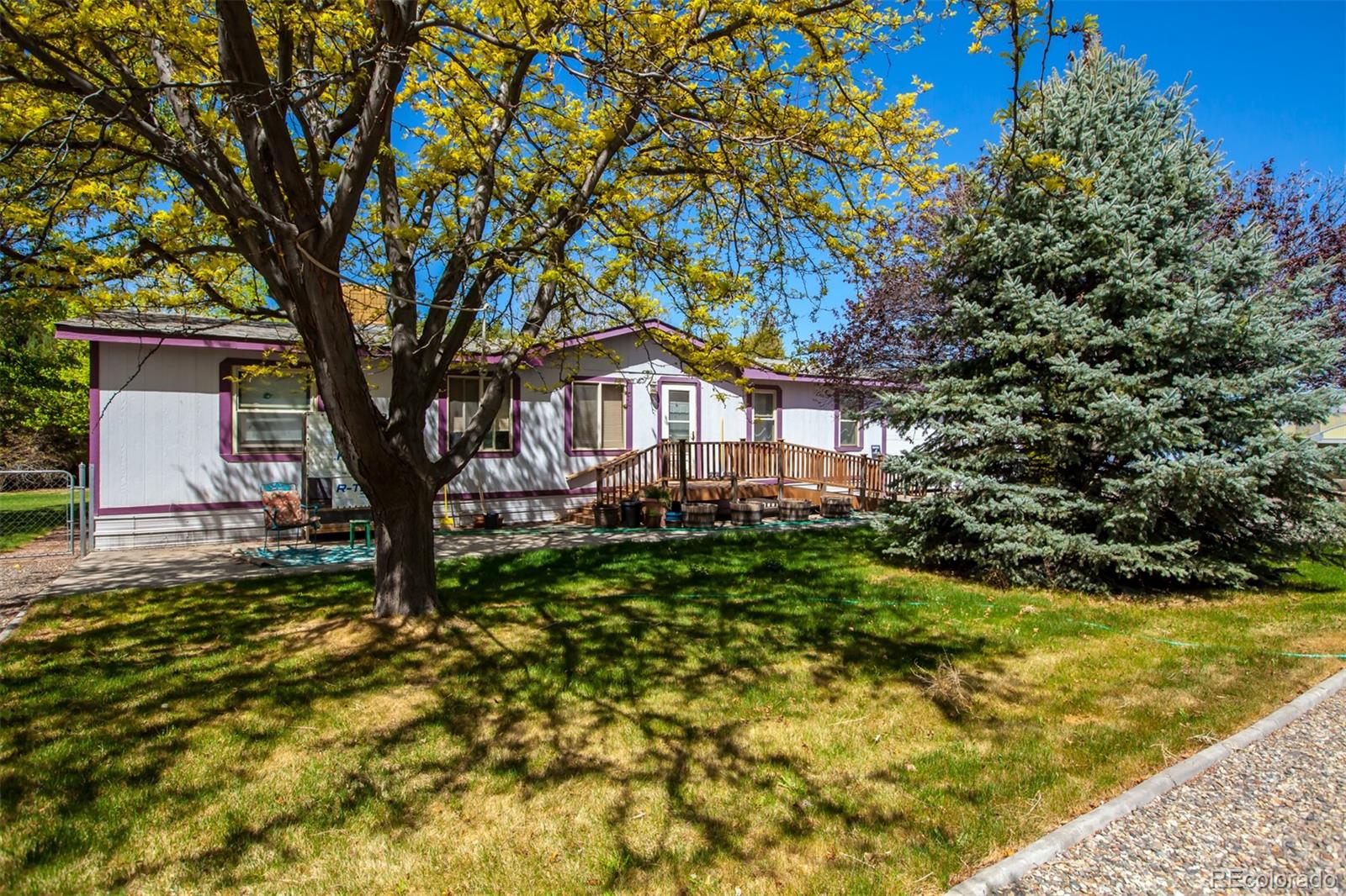 3281 C Road Palisade, CO 81526 - Photo 26 of 33 a house that has a tree in front of it