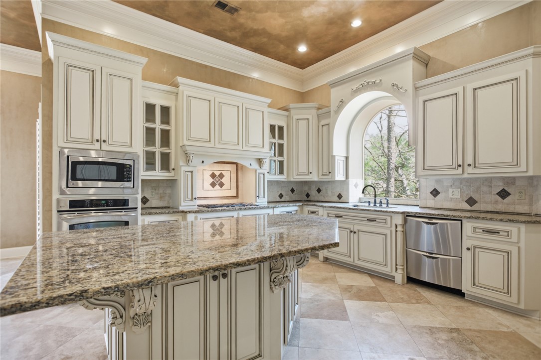 610 Highridge Drive Seneca, SC 29672 - Photo 12 of 50 This kitchen showcases elegant cabinetry, ample counter space, and modern appliances for daily living.