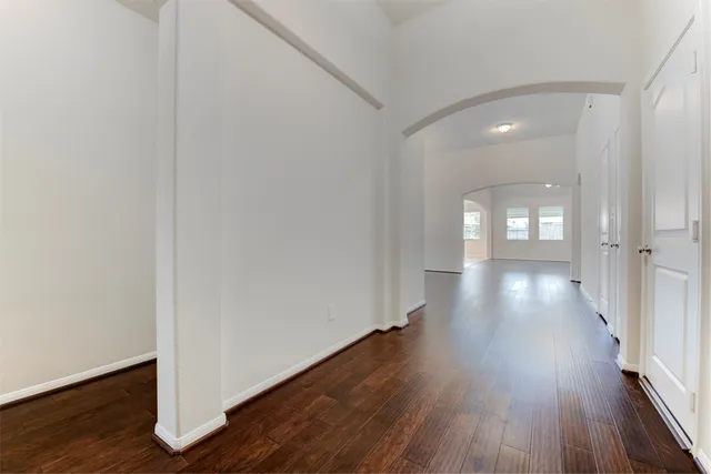 a view of gallery with wooden floor