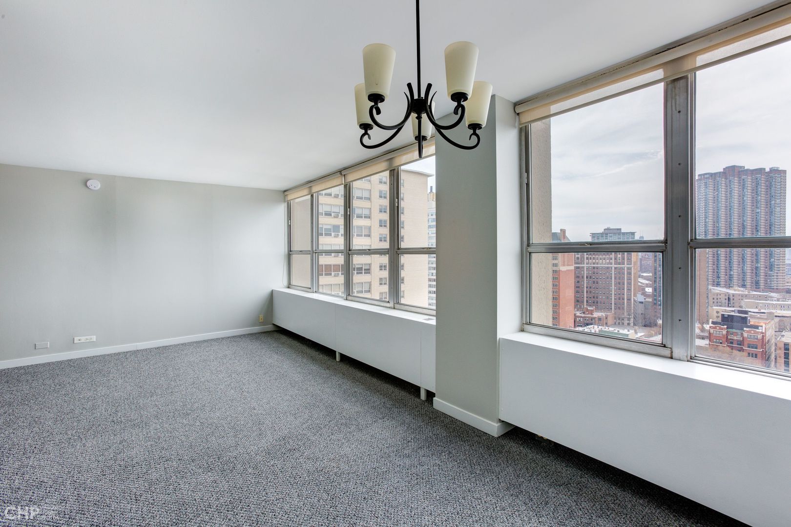 655 West Irving Park Road, Unit 1703 Chicago, IL 60613 - Photo 2 of 15 a view of an empty room with a window