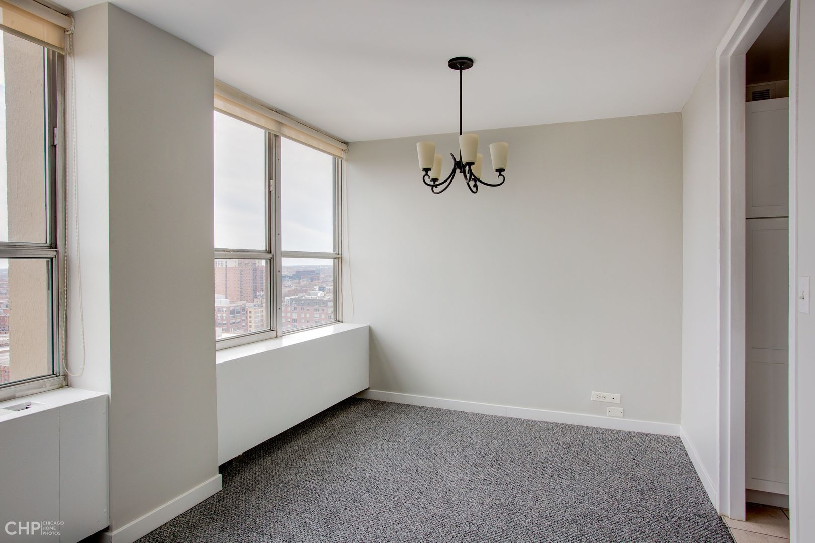 655 West Irving Park Road, Unit 1703 Chicago, IL 60613 - Photo 6 of 15 a view of an empty room with a window