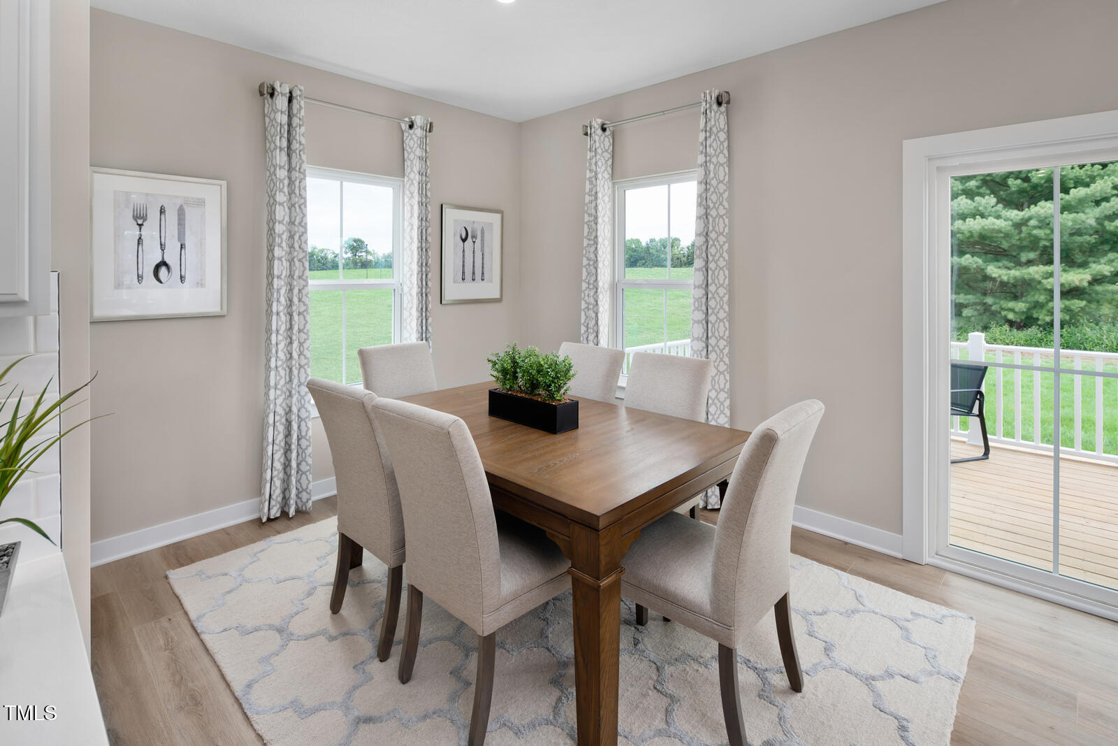 805 Walker Rdg Way Willow Spring, NC 27592 - Photo 10 of 29 a view of a dining room with furniture window and wooden floor