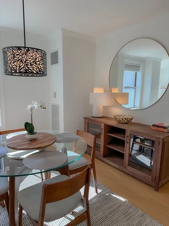 a kitchen with a table and chairs