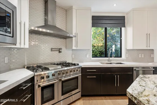 a kitchen with a stove and a sink