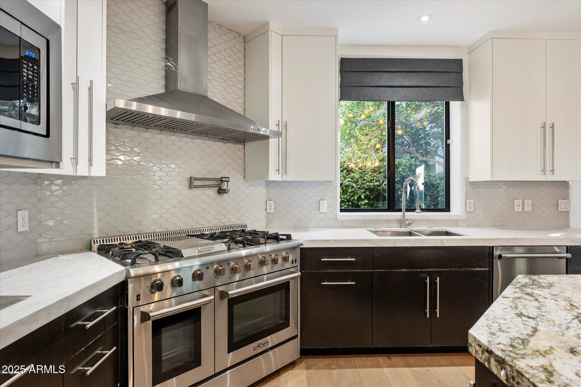 11 West San Juan Avenue Phoenix, AZ 85013 - Photo 12 of 40 a kitchen with a stove and a sink
