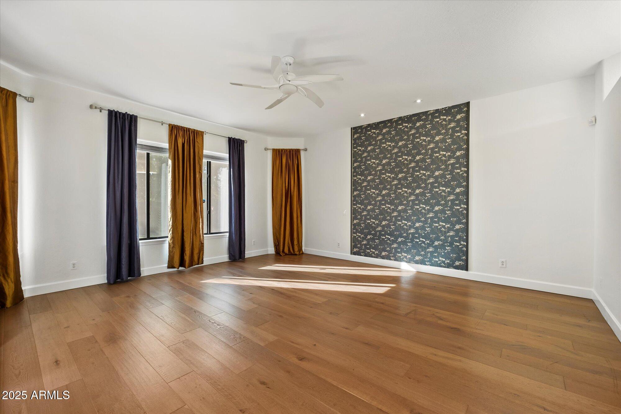 11 West San Juan Avenue Phoenix, AZ 85013 - Photo 20 of 40 a view of an empty room with a window and wooden floor