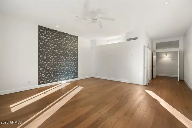 a view of an empty room and a window