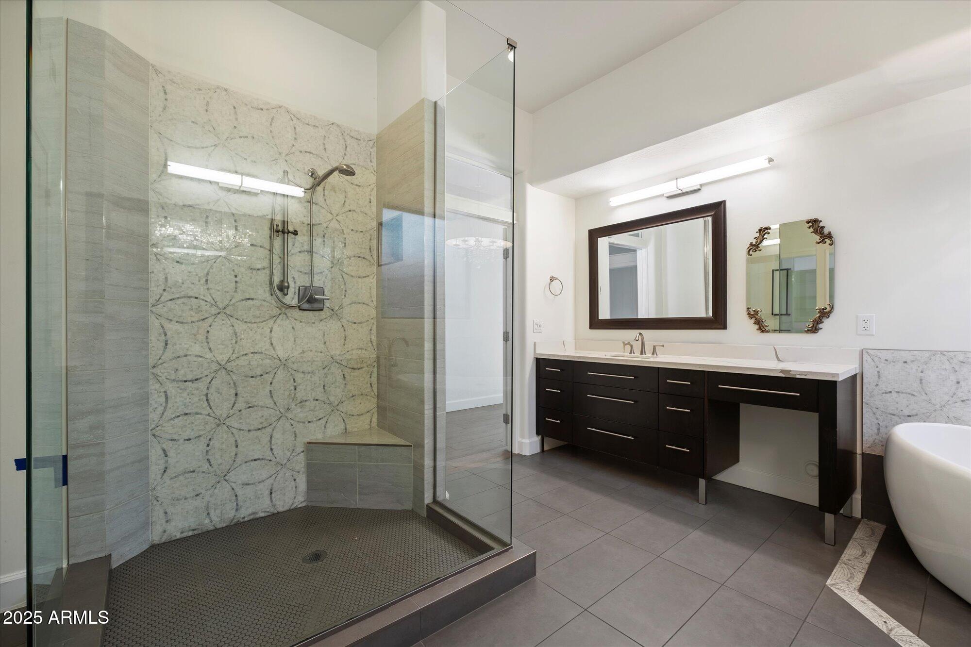 11 West San Juan Avenue Phoenix, AZ 85013 - Photo 22 of 40 a bathroom with a double vanity sink a mirror and a bathtub