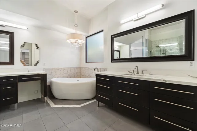 a bathroom with a sink double vanity and a mirror
