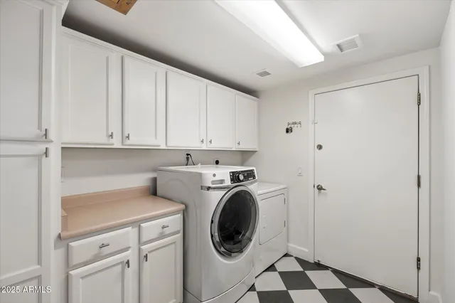 a view of a storage & utility room with washer and dryer