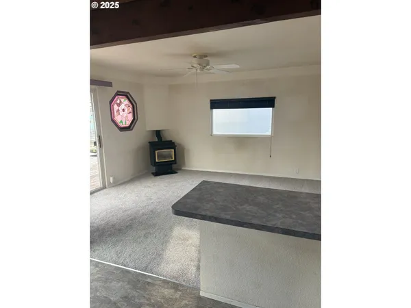 a view of an empty room with a window