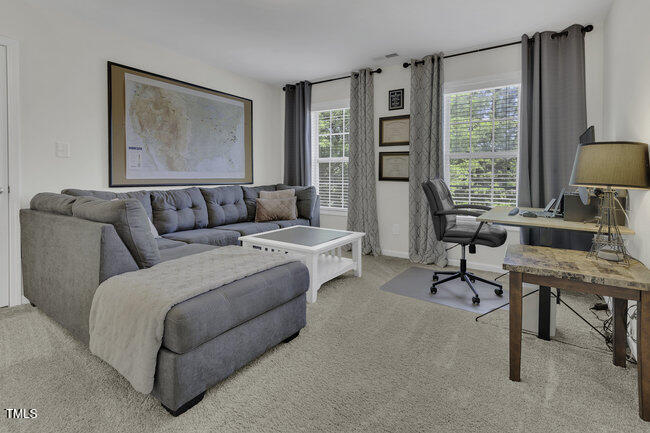 133 Pasadena Road Garner, NC 27529 - Photo 14 of 39 a living room with furniture and a window