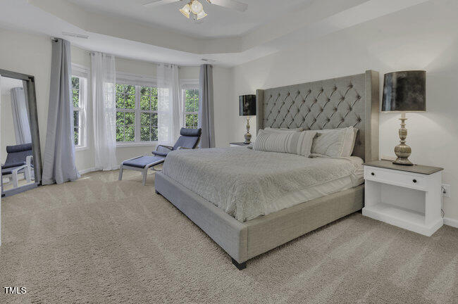 133 Pasadena Road Garner, NC 27529 - Photo 16 of 39 a large white bed in a white room