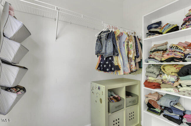 133 Pasadena Road Garner, NC 27529 - Photo 21 of 39 a view of walk in closet with clothes and shoes