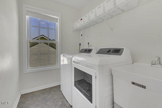 133 Pasadena Road Garner, NC 27529 - Photo 29 of 39 a utility room with dryer and washer