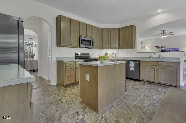 133 Pasadena Road Garner, NC 27529 - Photo 6 of 39 a kitchen with cabinets a sink and appliances