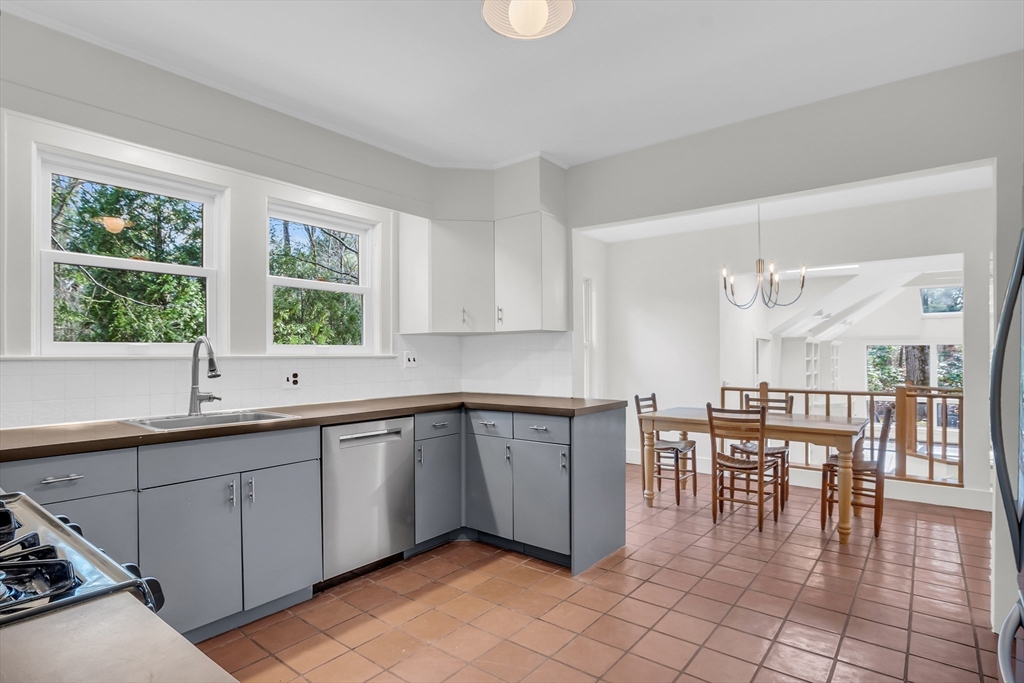 70 Middle Street Lexington, MA 02421 - Photo 11 of 37 a kitchen with a sink and chairs