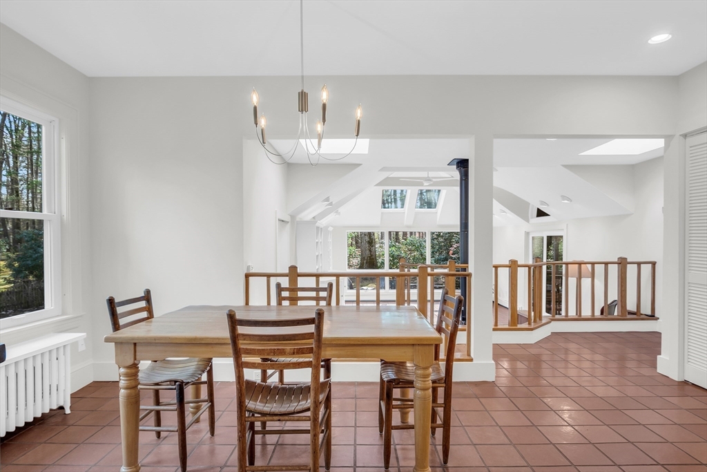 70 Middle Street Lexington, MA 02421 - Photo 12 of 37 a view of a dining room with furniture and wooden floor