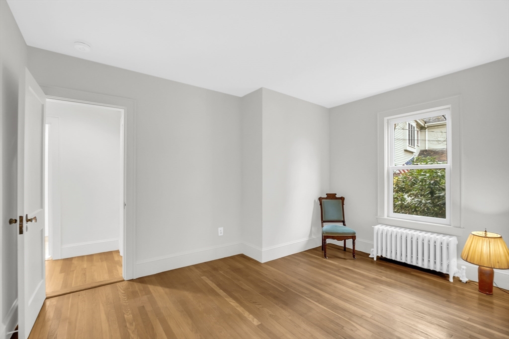 70 Middle Street Lexington, MA 02421 - Photo 17 of 37 an empty room with wooden floor and windows