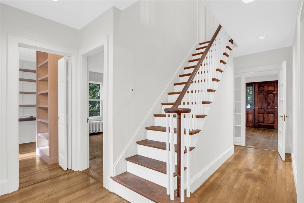 70 Middle Street Lexington, MA 02421 - Photo 19 of 37 a view of an entryway with wooden floor and stairs