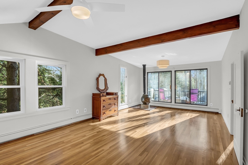 70 Middle Street Lexington, MA 02421 - Photo 20 of 37 a view of a livingroom with wooden floor and a large window