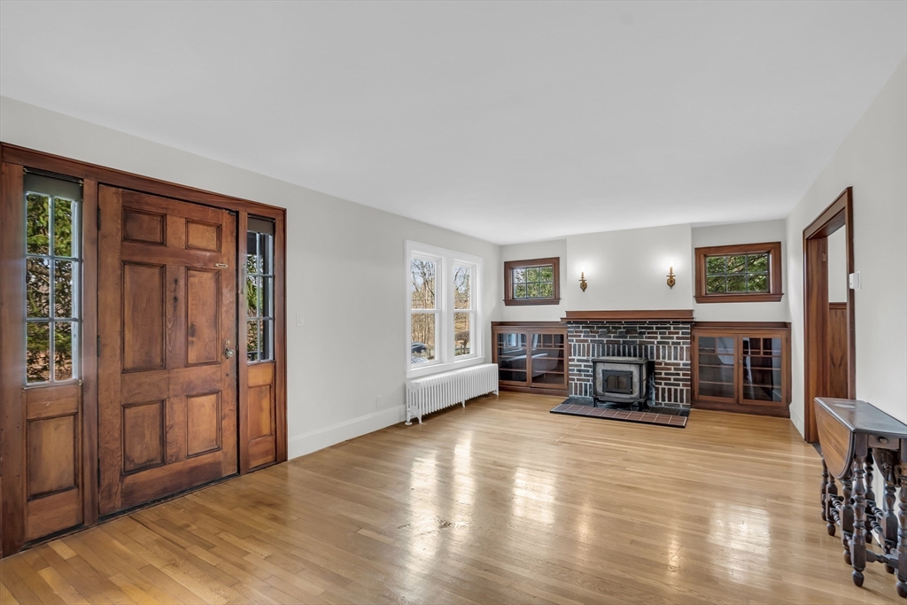 70 Middle Street Lexington, MA 02421 - Photo 2 of 37 an empty room with fireplace and windows