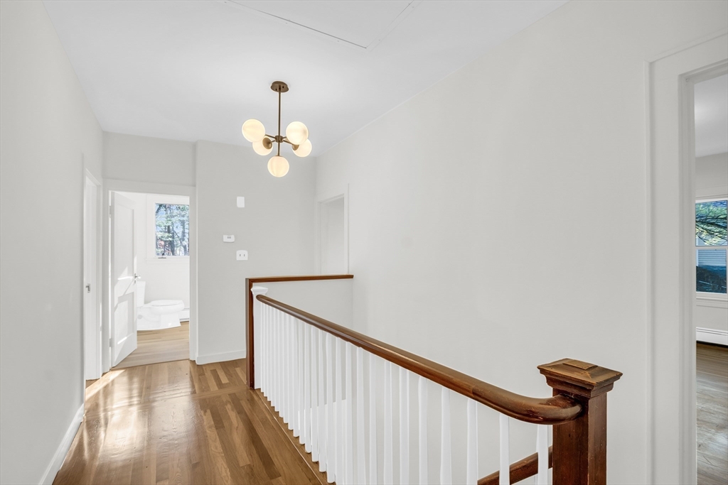 70 Middle Street Lexington, MA 02421 - Photo 26 of 37 a view of a hallway with wooden floor and staircase