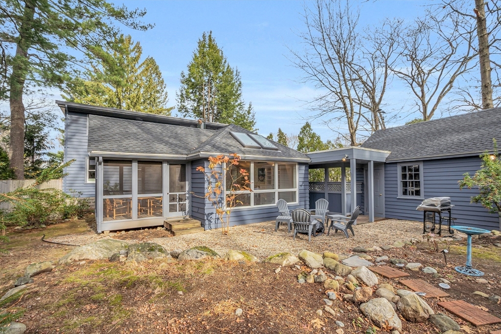 70 Middle Street Lexington, MA 02421 - Photo 31 of 37 a front view of a house with table and chairs