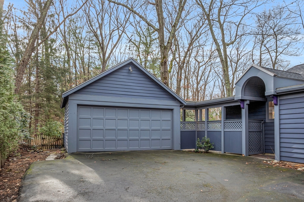 70 Middle Street Lexington, MA 02421 - Photo 35 of 37 a front view of a house with a garage
