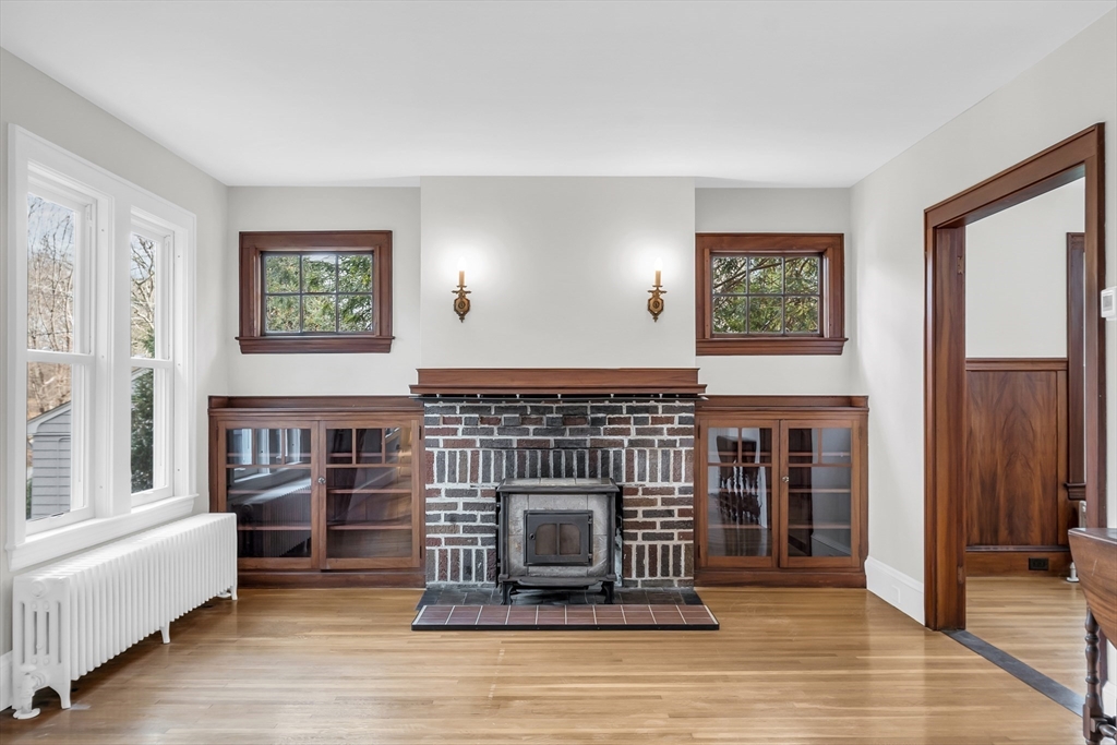 70 Middle Street Lexington, MA 02421 - Photo 5 of 37 a living room with fireplace furniture and a window