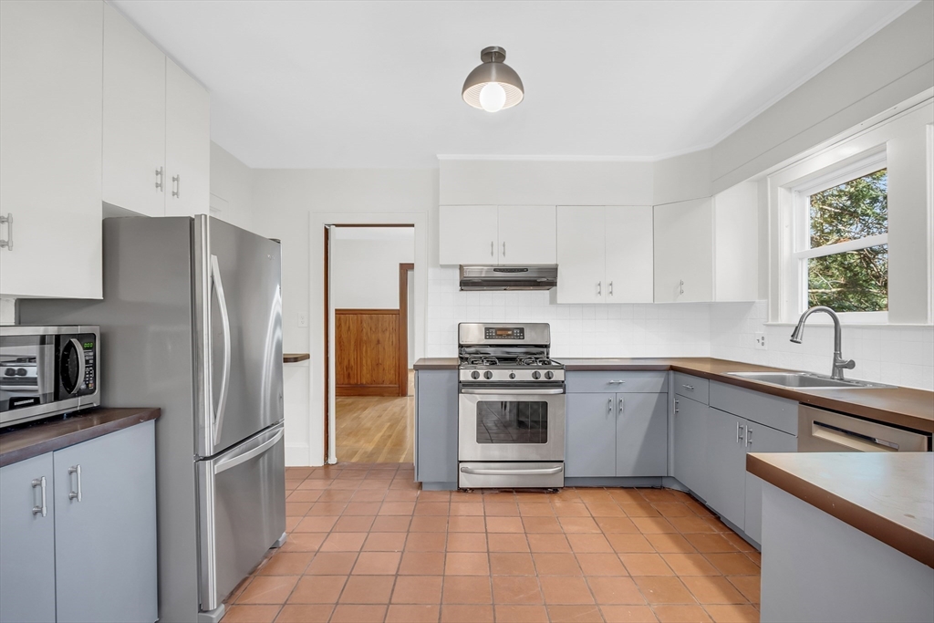70 Middle Street Lexington, MA 02421 - Photo 9 of 37 a kitchen with a refrigerator sink and stainless steel appliances