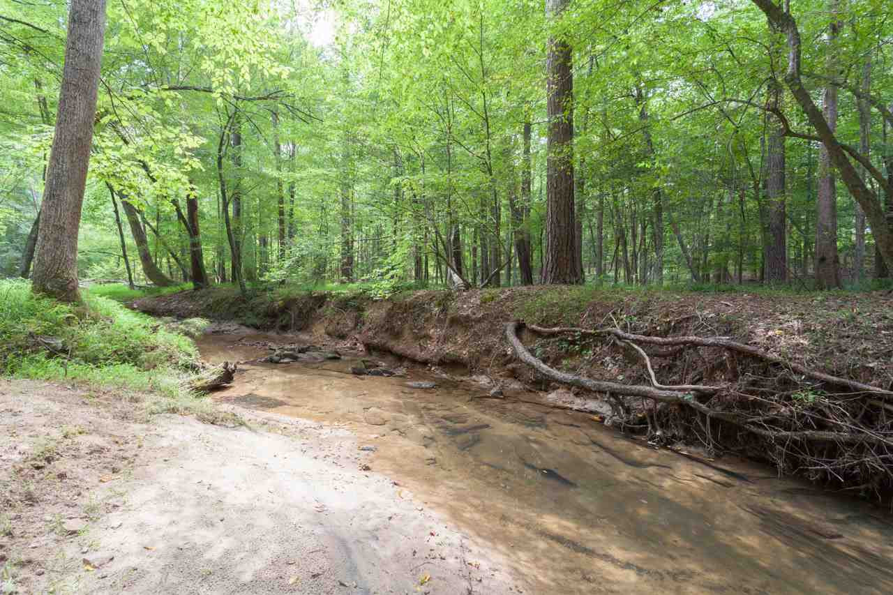 4921 Cremshaw Court Raleigh, NC 27614 - Photo 25 of 25 Beyond the fence, a beautiful woodland trail leads you from the top of the backyard, through a canopy of trees to the creek below. Imagine having your very own nature trail! Your Personal Creekside Retreat