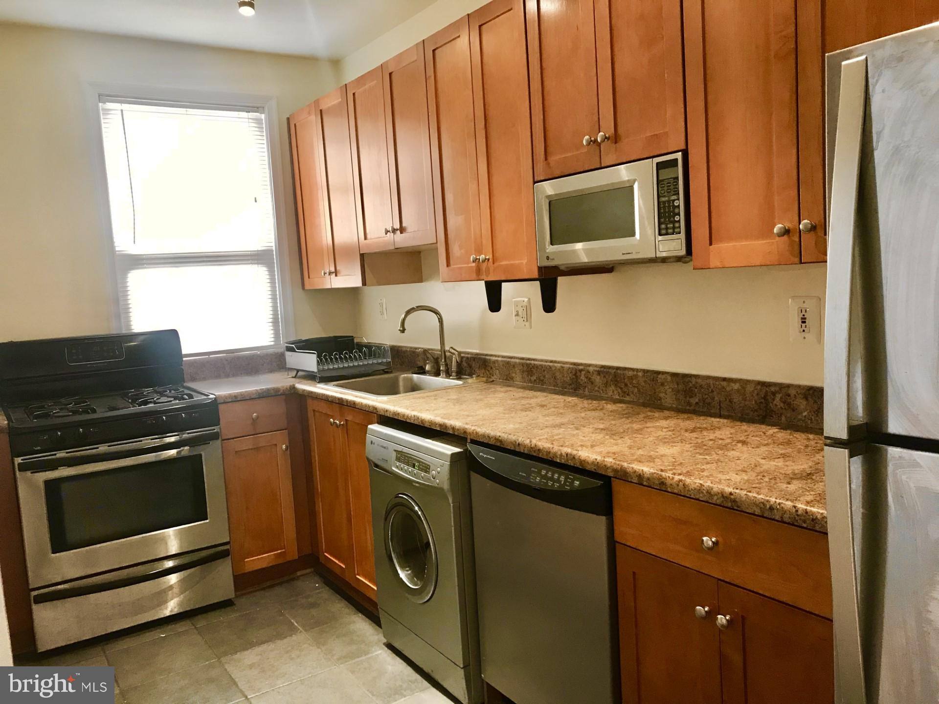 1439 Euclid Street Northwest, Unit 202 Washington, DC 20009 - Photo 5 of 9 Modern kitchen with sleek finishes.