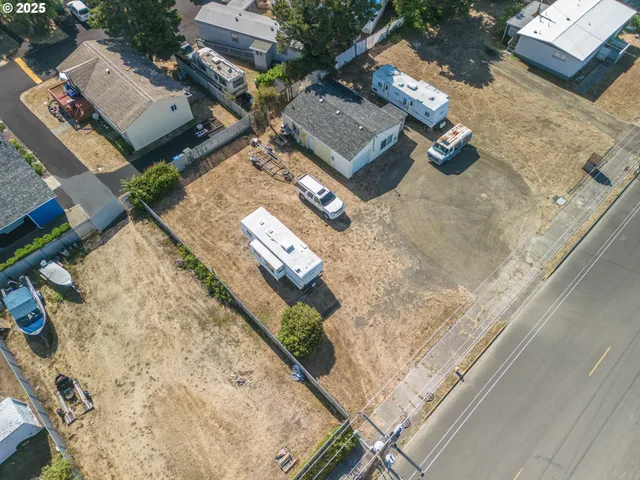 an aerial view of a house with a ocean view