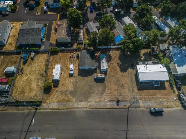 an aerial view of residential houses with outdoor space