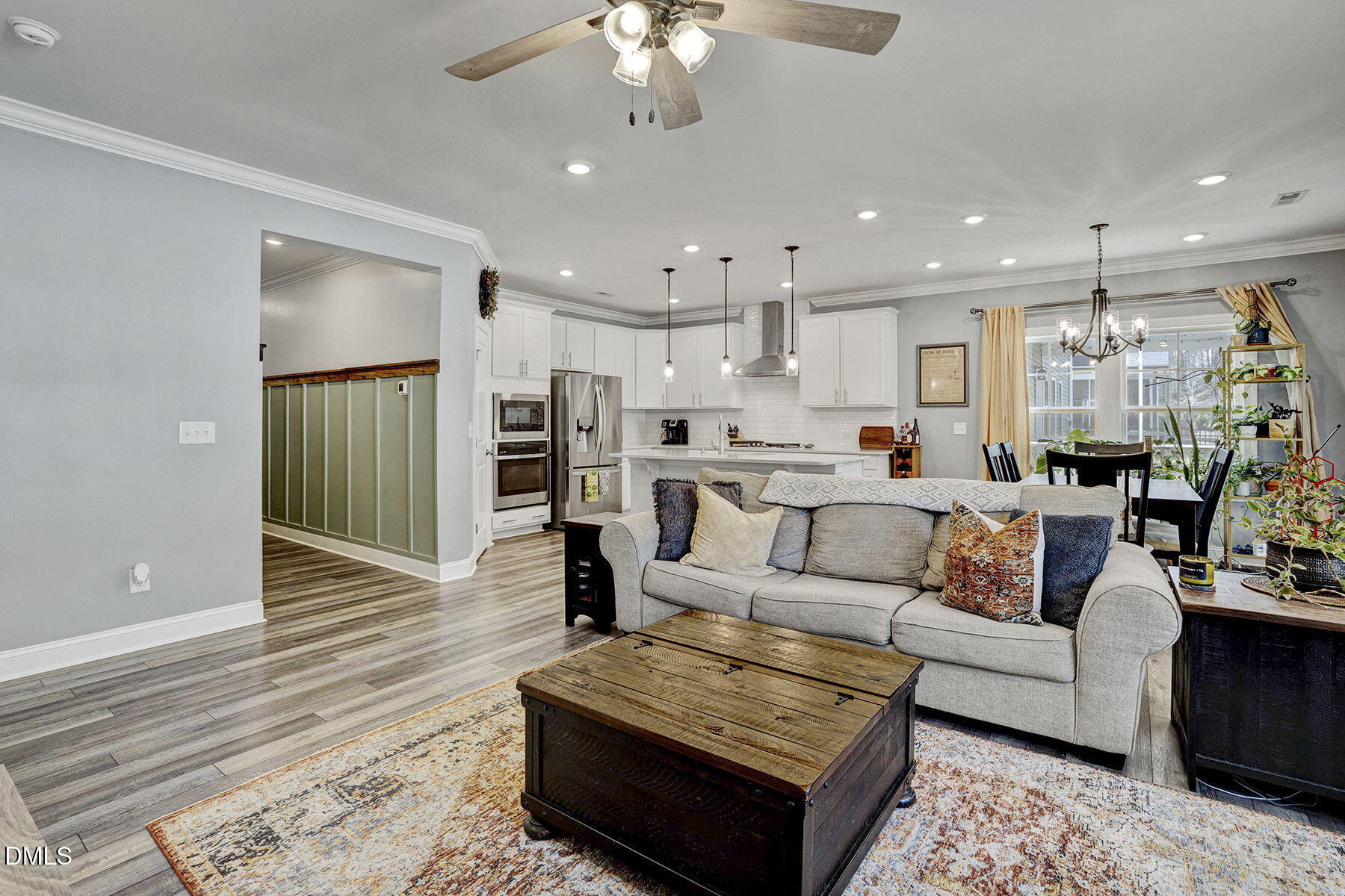 244 Chateau Way Angier, NC 27501 - Photo 11 of 30 a living room with furniture and kitchen view