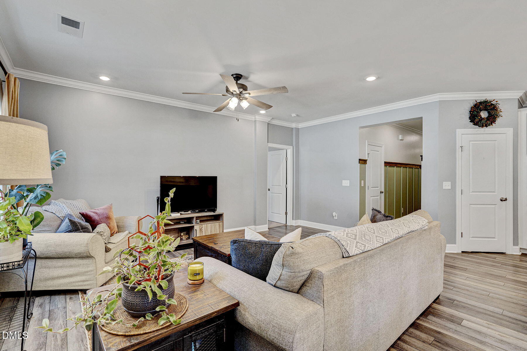 244 Chateau Way Angier, NC 27501 - Photo 12 of 30 a living room with furniture and a flat screen tv