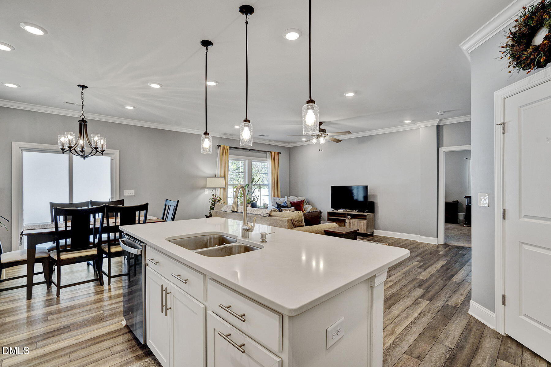 244 Chateau Way Angier, NC 27501 - Photo 15 of 30 a kitchen with a sink a counter space appliances and cabinets