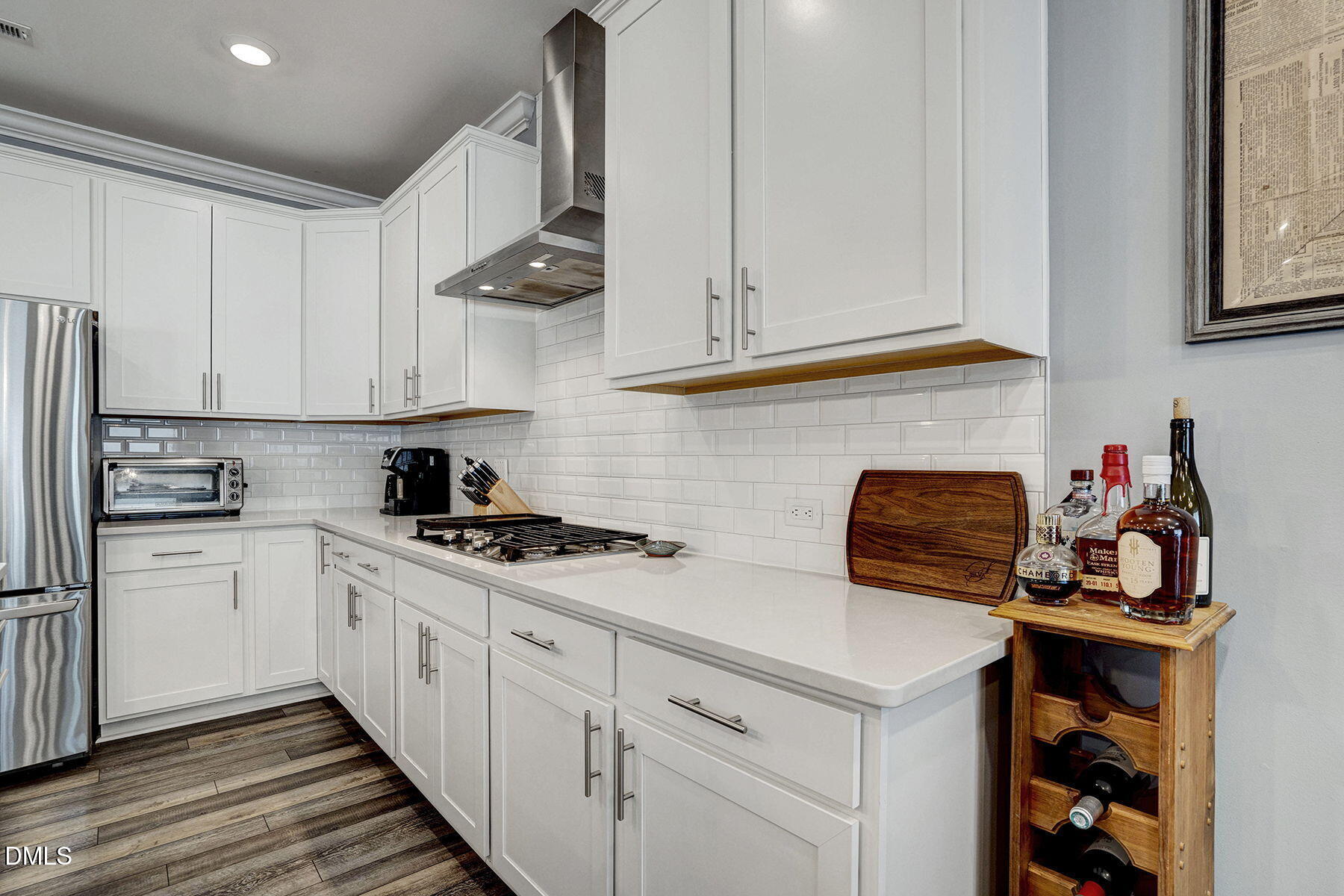 244 Chateau Way Angier, NC 27501 - Photo 17 of 30 a kitchen with stainless steel appliances a stove a sink and cabinets