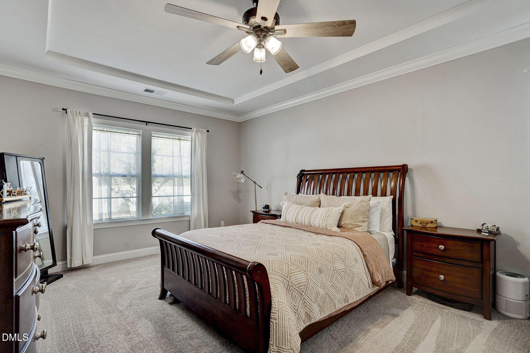244 Chateau Way Angier, NC 27501 - Photo 19 of 30 a bedroom with a bed and a chandelier
