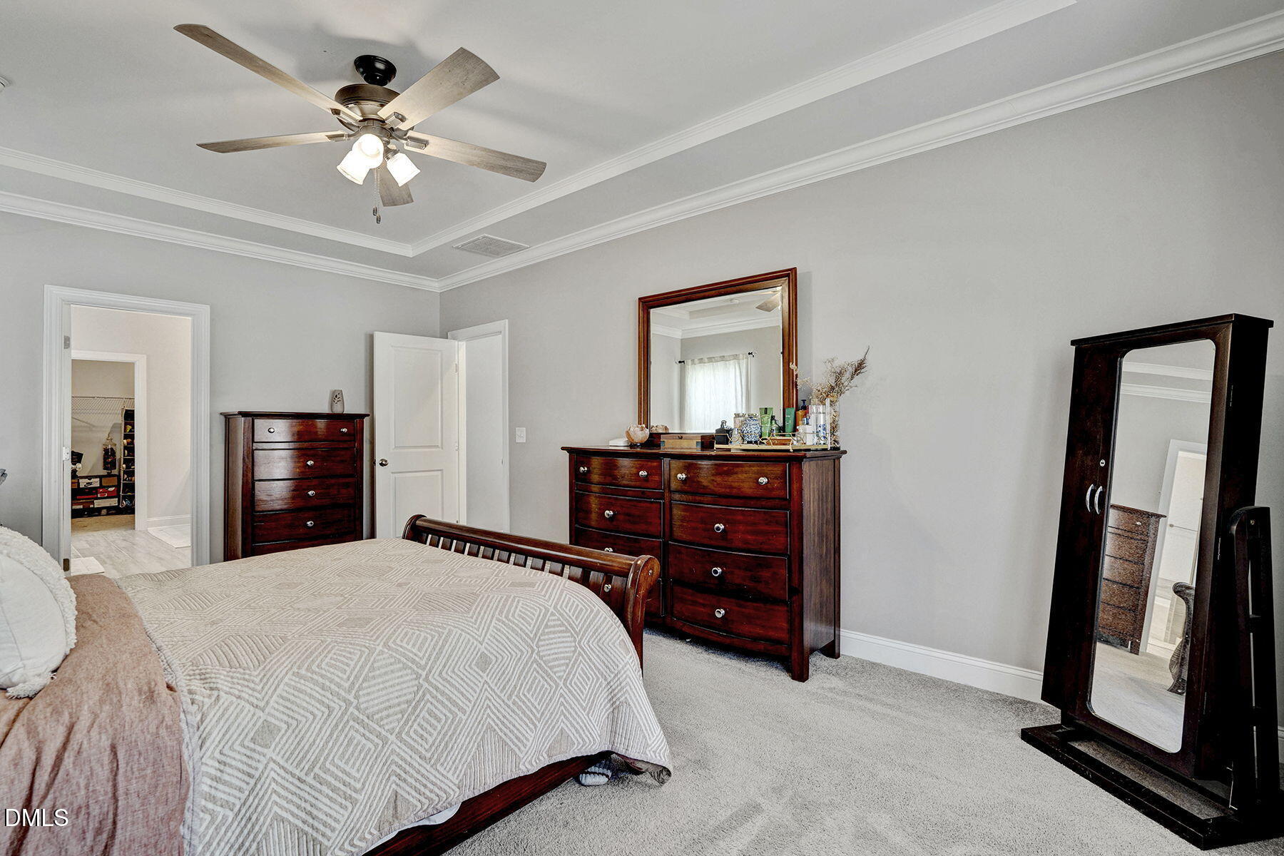 244 Chateau Way Angier, NC 27501 - Photo 20 of 30 a bedroom with a bed and a chandelier