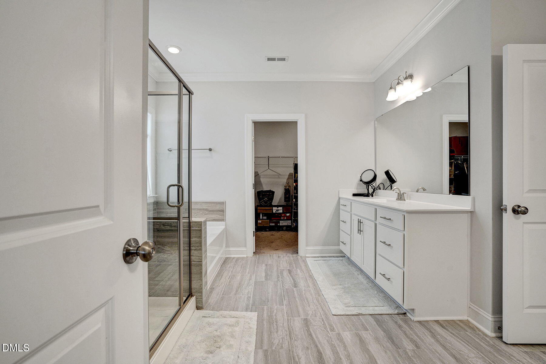 244 Chateau Way Angier, NC 27501 - Photo 21 of 30 a view of a hallway with closet and wooden floor