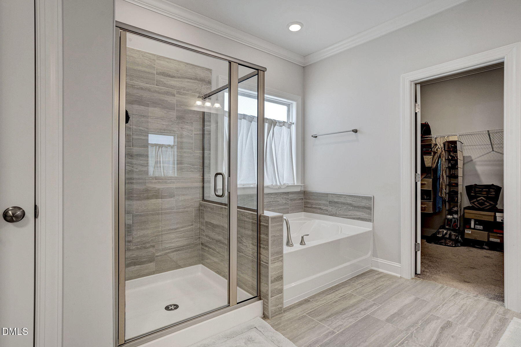 244 Chateau Way Angier, NC 27501 - Photo 22 of 30 a bathroom with a bathtub and a shower