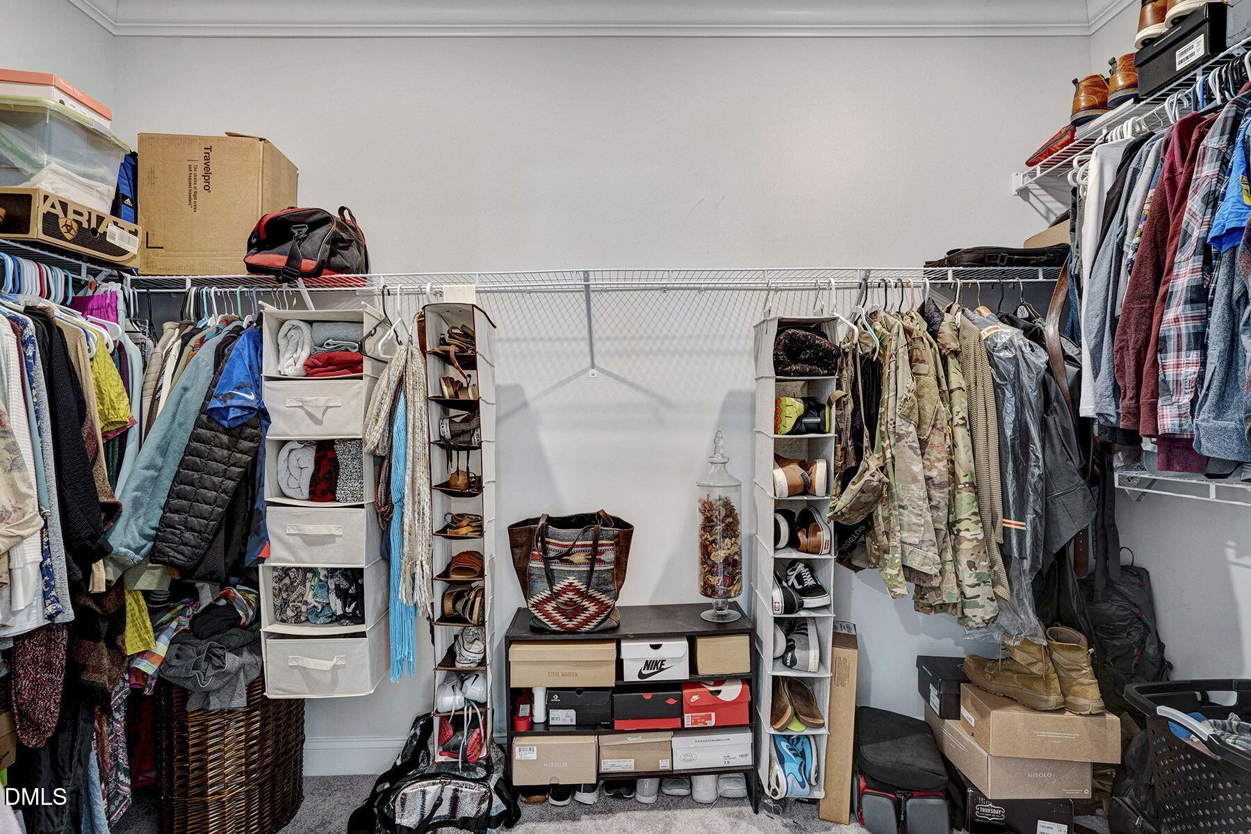 244 Chateau Way Angier, NC 27501 - Photo 24 of 30 a view of walk in closet with clothes and shoes