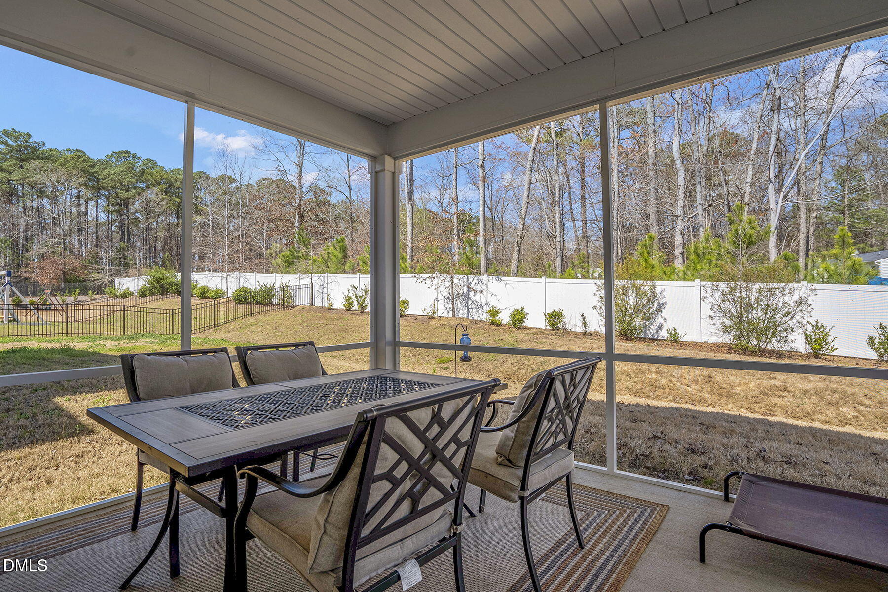 244 Chateau Way Angier, NC 27501 - Photo 25 of 30 a view of a patio with a table chairs and a table