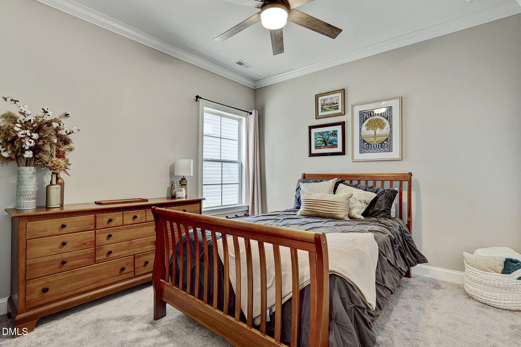 244 Chateau Way Angier, NC 27501 - Photo 8 of 30 a bedroom with a bed and a chandelier