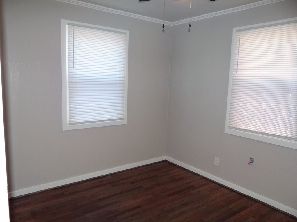 345 29th Avenue Columbus, GA 31903 - Photo 16 of 18 a view of a room with wooden floor and windows in it
